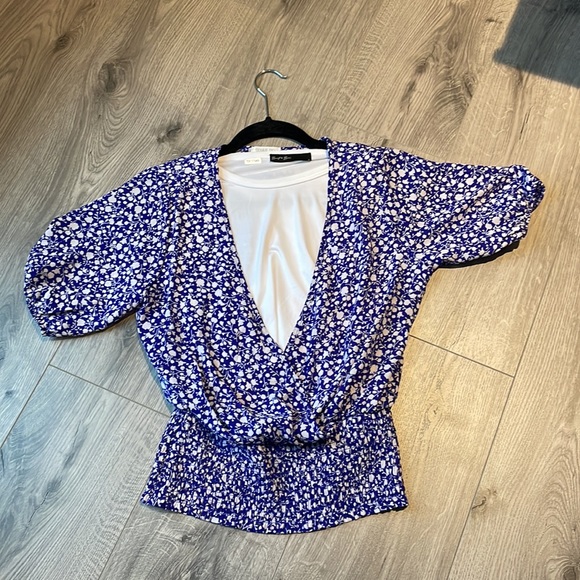 Faux wrap top with a snap closure & smocked at the  waist. - Picture 3 of 7